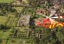 The Essex & Herts Air Ambulance above Hatfield House.