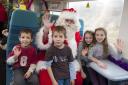 Father Christmas with surprised kids