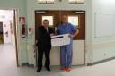 Declan Kelly presented a cheque worth £25,000 to Professor Tim Briggs of the  Royal National Orthopaedic Hospital