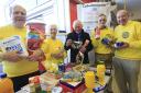 Rotarians help collect food at Tescos last week