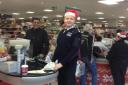 Borough Commander Simon Ovens packed bags at a supermarket in South Harrow to raises money for the First Stanmore Troop Girls Brigade