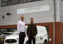 Laseraid chief executive Tom Acland (left) and commercial director Jamel Hussain outside the new showroom, training academy and service centre in Borehamwood