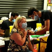 A woman has the Covid vaccine at a pop-up clinic at Watford Football Club last weekend. Credit: Watford Borough Council
