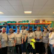 Pictured are the WD6 Food Support volunteers at Parkside Community Primary School in Borehamwood, along with two of the school's governors. WD6 Food Group received £1,850 to support its work