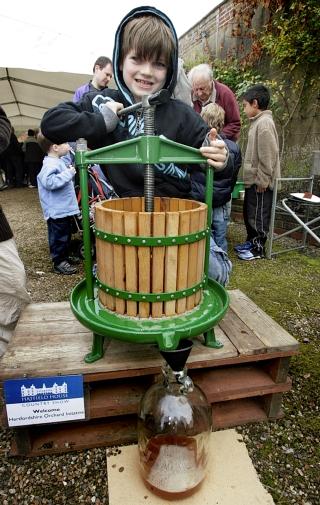 Oliver Kelly, eight, apple pressing