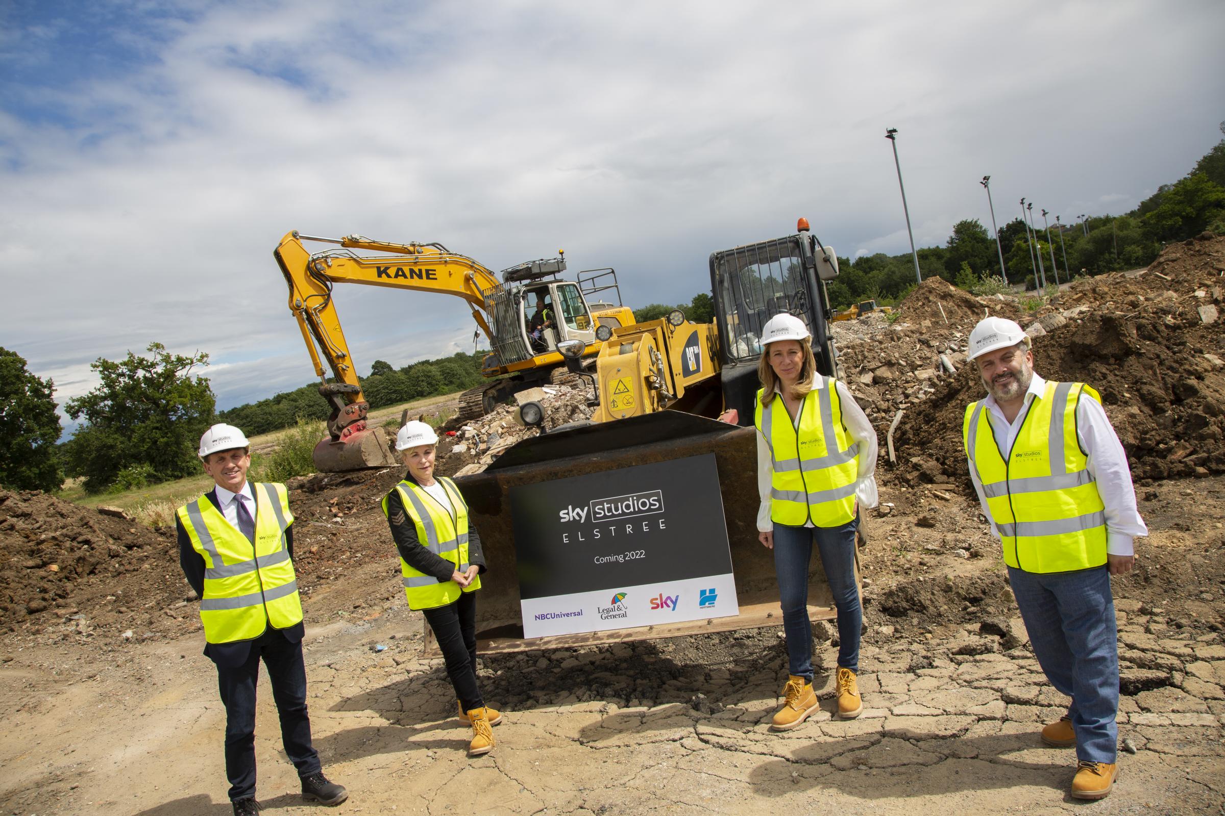 L-R: Nigel Wilson (CEO, Legal & General), Helen Parker (EVP of Universal Pictures Content Group, NBCUniversal), Caroline Cooper (CFO, Sky Studios) and Cllr. Morris Bright MBE (Leader of Hertsmere Borough Council) on the building site of Sky Studios Elstre