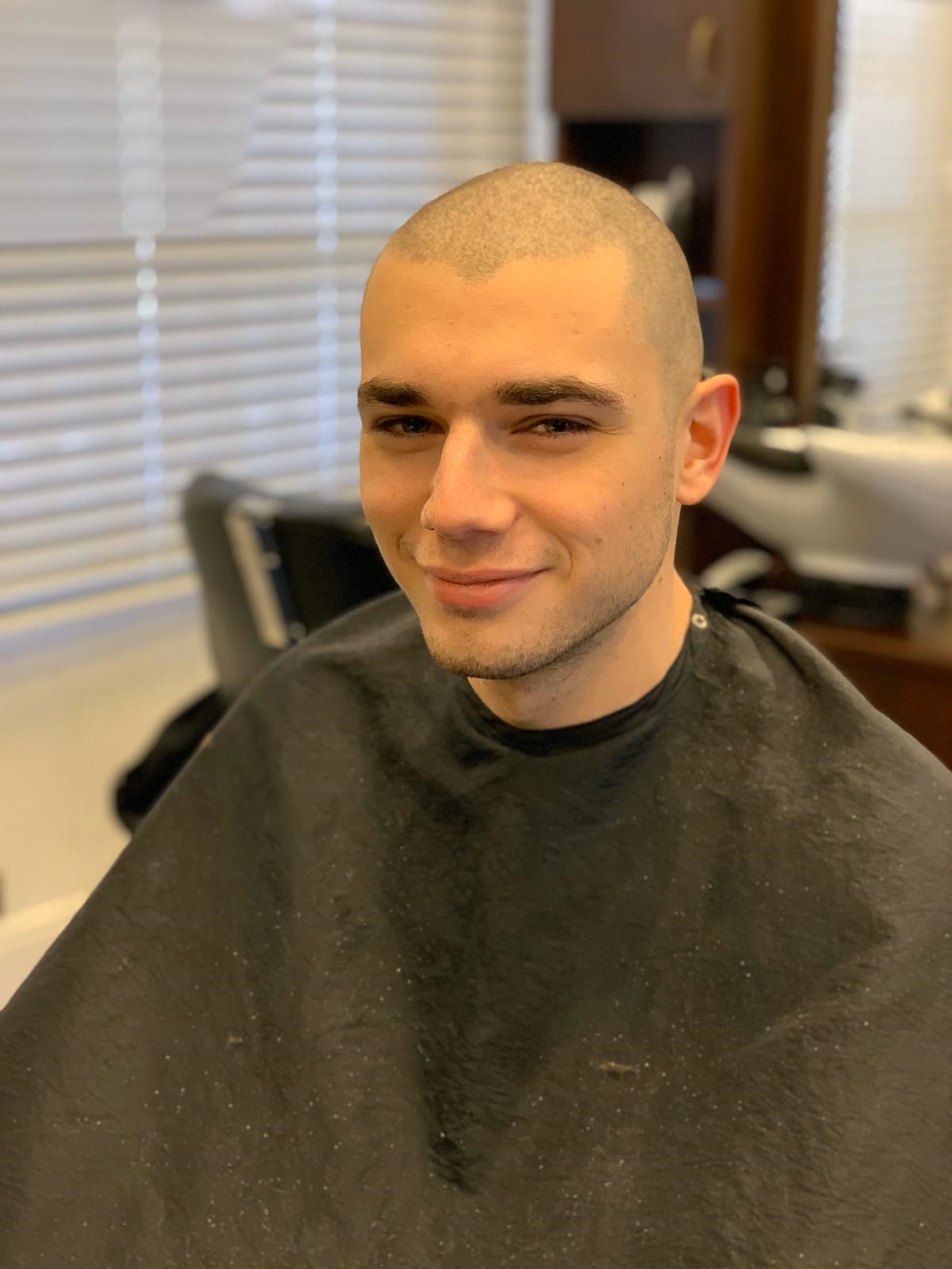 Jamie shaved his own hair and raised more than £17,000