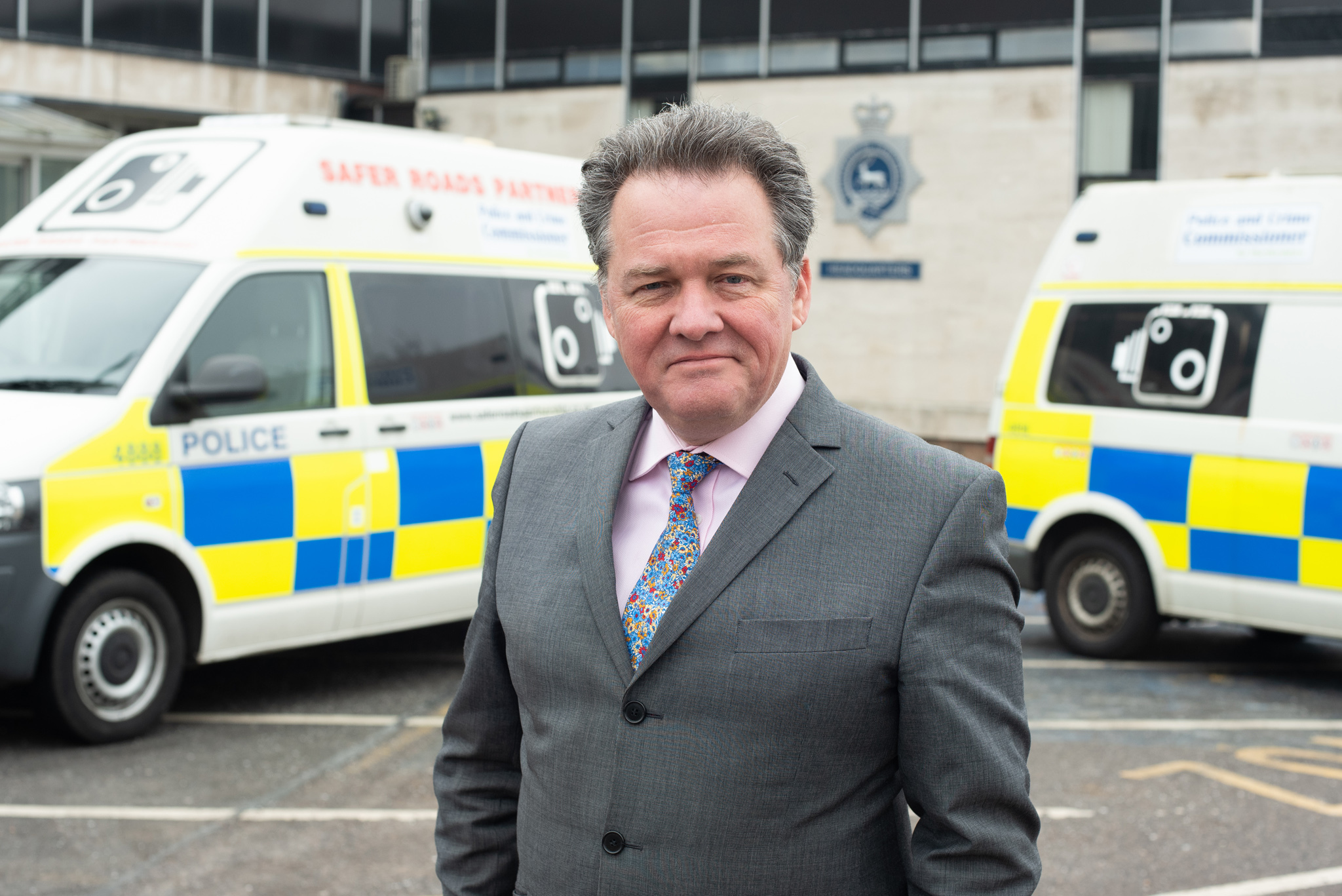 Hertfordshire police and crime commissioner David Lloyd pictured with the two new road safety vans in March