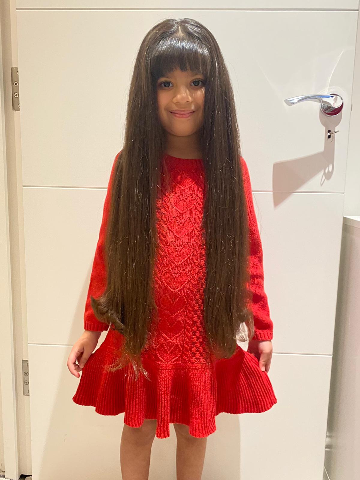 Nikki had never had a proper haircut in her life and her hair had grown to 71cm. Credit: Tina Nandha