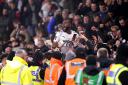 Tyrone Marsh celebrates with the Boreham Wood fans after the momentous 1-0 FA Cup win at Bournemouth. Credit: PA