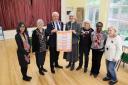 The mayor of Hertsmere Cllr John Graham helps launch a Warm Spaces venue in Borehamwood