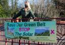 Campaigner Sharon Woolf pictured with a banner in Radlett opposing the solar farm proposal. Credit: Lynn Margolis Photography