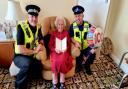 Sergeant Noel Buckley and PCSO Milan Boca pictured with Doreen on her birthday. Credit: Herts Police