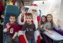 Father Christmas with surprised kids