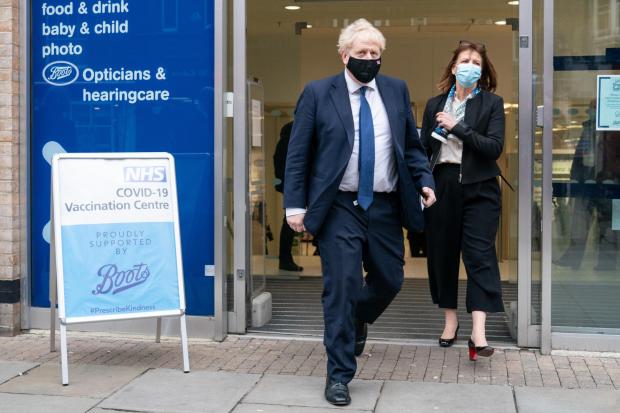 Borehamwood Times: Prime Minister Boris Johnson leaving the Boots Pharmacy vaccination clinic in Uxbridge, west London, today. Credit: PA