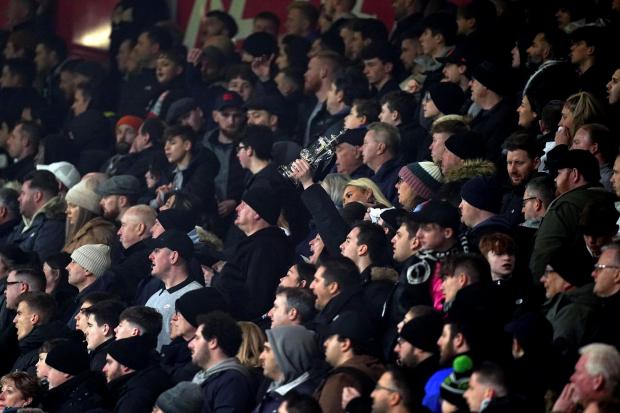 Borehamwood Times: Boreham Wood fans cheer on their side at Bournemouth's Vitality Stadium. Credit: PA