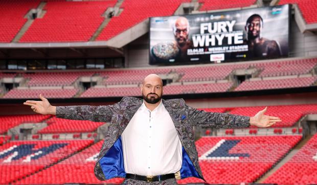 Borehamwood Times: Tyson Fury poses on the pitch after the press conference at Wembley Stadium, London (PA)