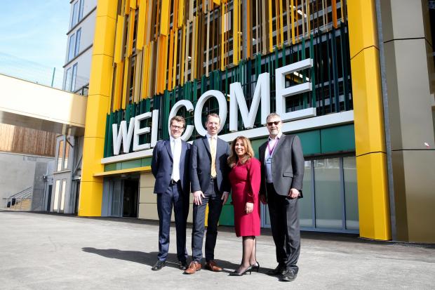 Borehamwood Times: left to right: Duncan McDonald, projects director at Kier, Watford mayor Peter Taylor, Fareen Lalani, senior development director at Kier, and Tim Duggleby, associate director of acute redevelopment at West Hertfordshire Hospitals at the new car park 
