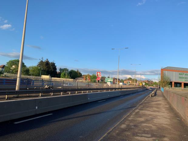 Borehamwood Times: One lane is closed in both directions on the A41 on the bridge that runs over the M1 by Apex Corner, which is pictured in the background. While it is clear to get onto the A41, there is gridlock getting onto Apex Corner
