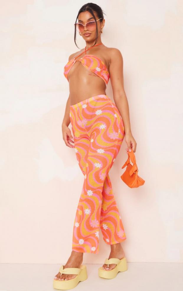 Borehamwood Times: Orange Flower Swirl Print Knit Flare Trousers (PrettyLittleThing)