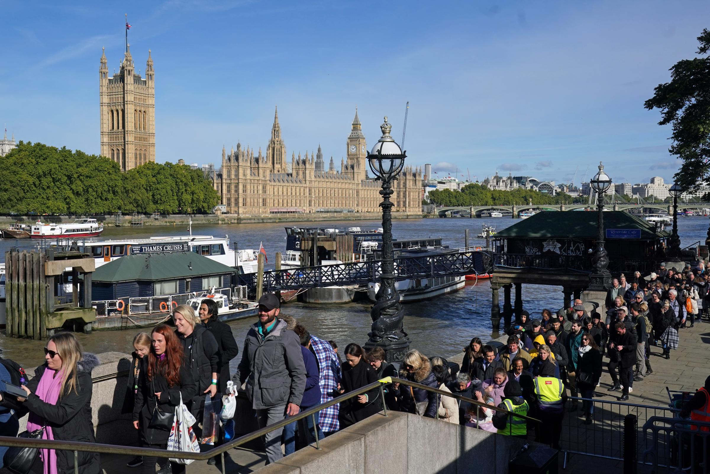 Members of the public in the queue between Westminster Bridge and Lambeth Bridge in London, as they wait to view Queen Elizabeth II lying in state ahead of her funeral on Monday. Picture date: Sunday September 18, 2022.