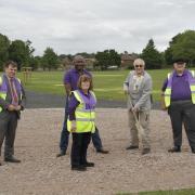 left to right: Andrew Grady, Cllr Victor Eni, Clive Butchins, and Nick Male along with town council leader Pat Strack on the site where the bandstand will be constructed very soon