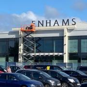 The Debenhams sign being taken down at Borehamwood Shopping Park today (September 2). Credit: Bob Redman