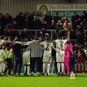 Boreham Wood players celebrate at full time during the Emirates FA Cup third round match at the LV Bet Stadium Meadow Park. Credit: PA