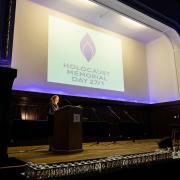 Mayor of Hertsmere, Cllr Anne Swerling, leads a service at Bushey Arena on January 27 to mark Holocaust Memorial Day. Credit: Hertsmere Borough Council