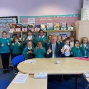 Hertsmere MP Oliver Dowden with pupils from Parkside Community Primary School in Borehamwood
