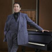 Jools Holland standing at the piano - photo by Mary McCartney