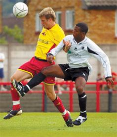 Tough test: the Boreham Wood striker Leon Archer, right, challenges for the ball in the pre-season friendly against Watford, which Wood lost 5-2				